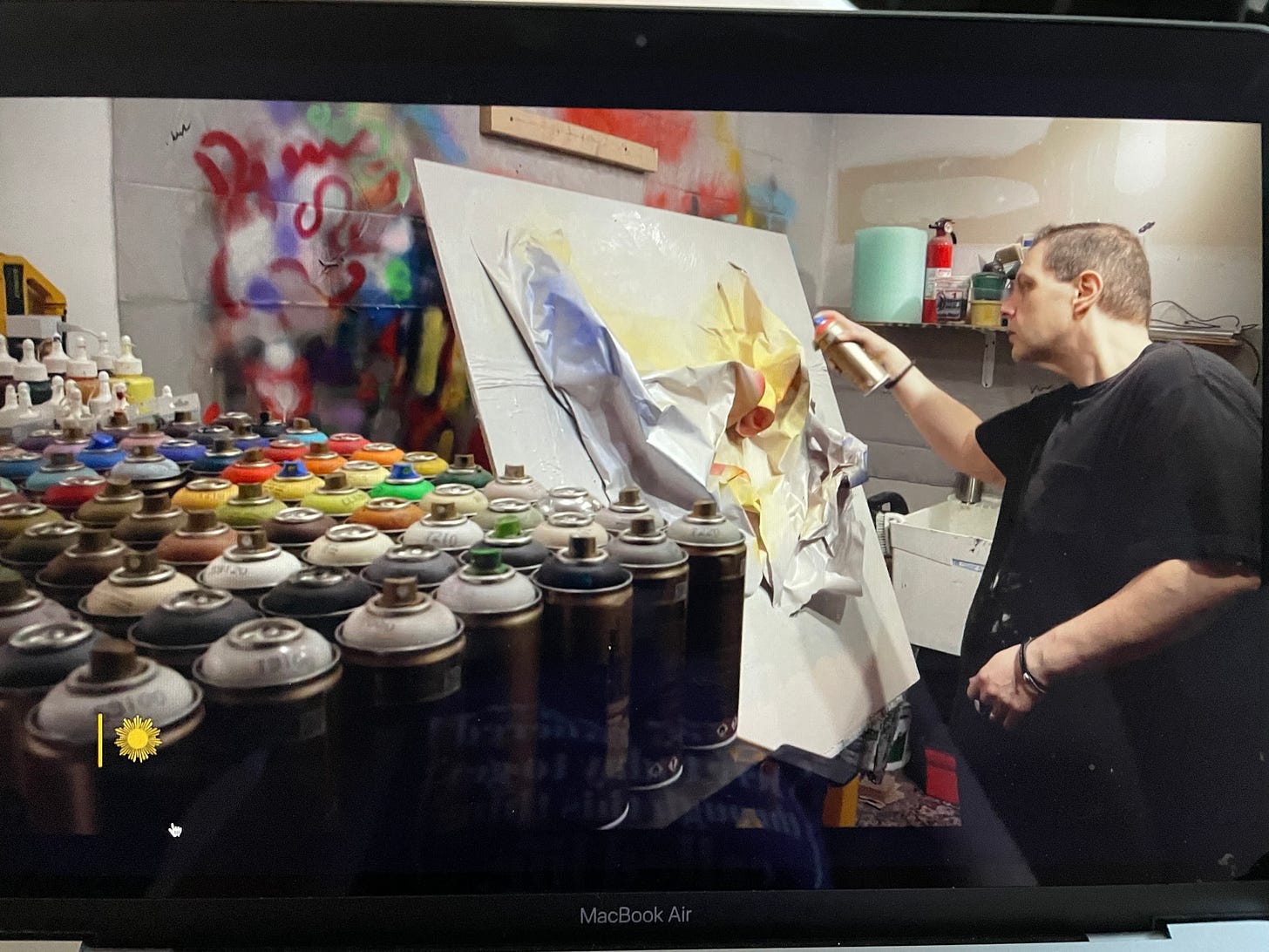 Artist Drew Griffiths in his studio creating an abstract painting