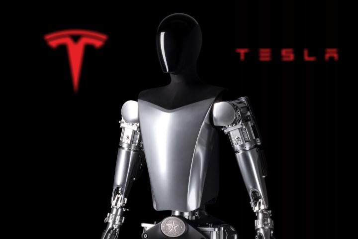 Tesla's 2022 Optimus robot prototype is seen in front of the company logo.