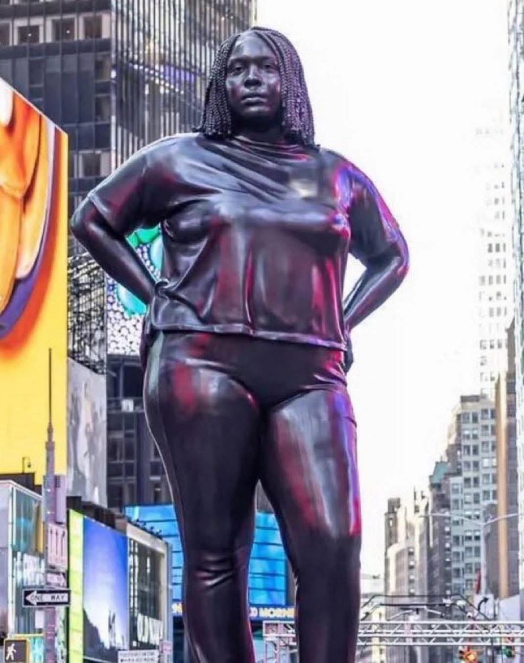 May be an image of 1 person, Times Square and text