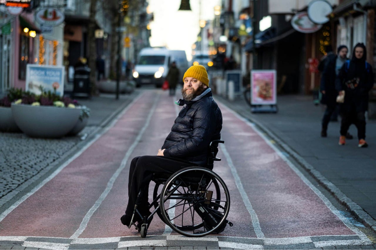  Haraldur “Halli” Thorleifsson in the middle of the street on a wheelchair