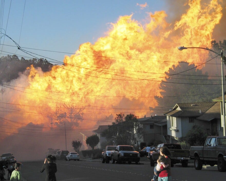 FILE - In this Sept. 9, 2010, file photo, a massive fire roars through a mostly residential neighborhood in San Bruno, Calif.  (AP Photo/Michael Sah, file)