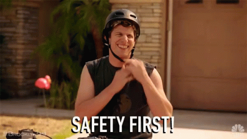 Gif of someone pointing, putting on the helmet and saying safety first on a bicycle