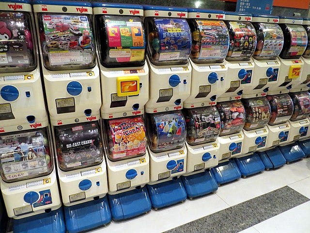 A big honkin’ wall that’s chock full a’ those capsule-dispensin’ toy machines.