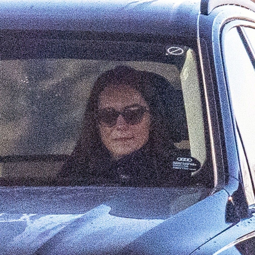 Kate Middleton sitting in a car