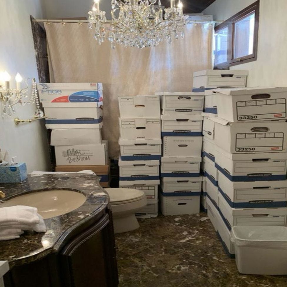 A photo allegedly shows boxes of classified documents in a bathroom.