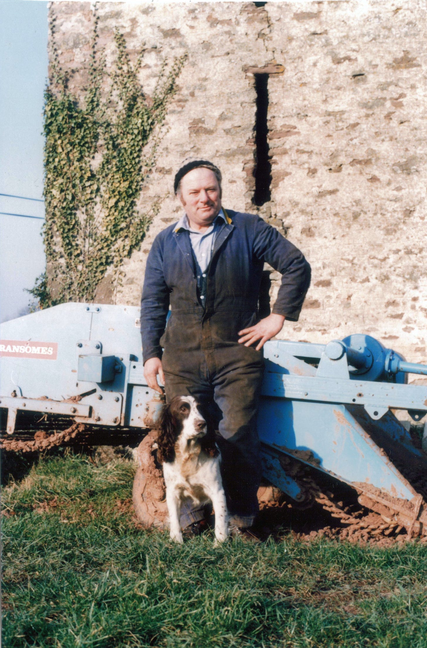 Rolie Morris in his work overalls and hound Jenny on the farm at Bridstow, nr Ross-on-Wye