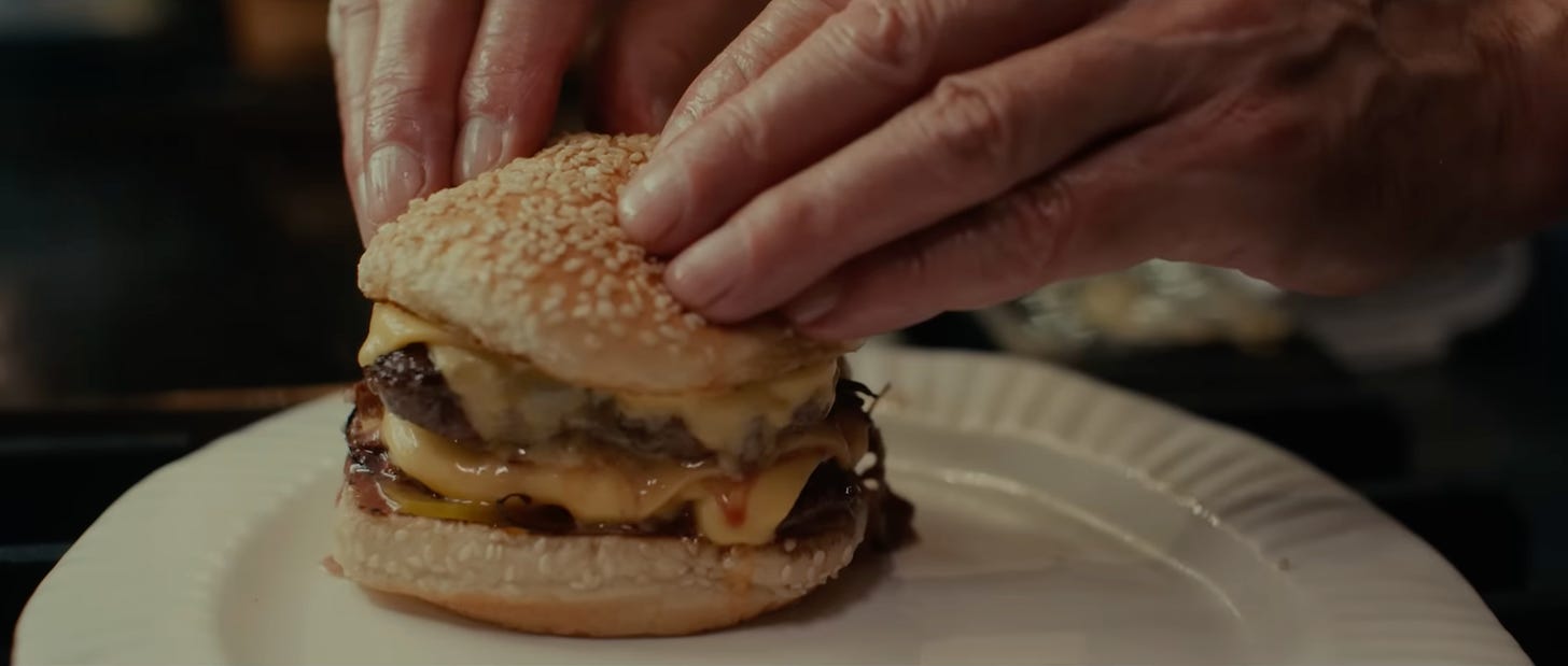 Still from the movie "The Menu" of the cheeseburger
