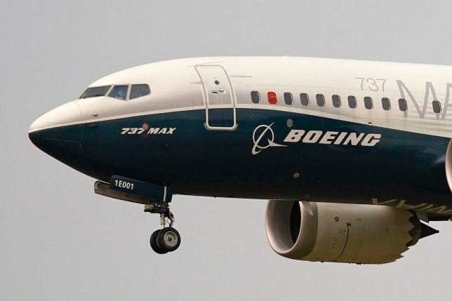 A Boeing 737 Max jet prepares to land.