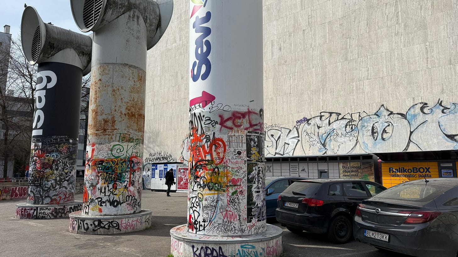 May be an image of 1 person, parking meter, street and text