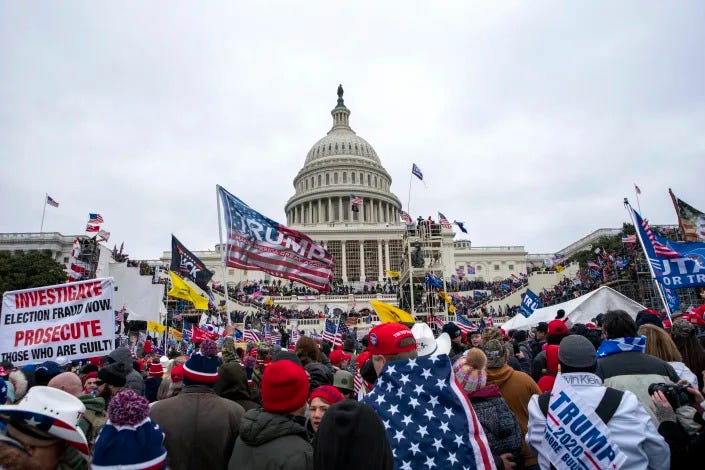 FILE - Insurrections loyal to President Donald Trump rally at the U.S. Capitol in Washington on Jan. 6, 2021. A growing number of Capitol rioters are facing hefty fines on top of prison sentences at their sentencing hearings. That's because prosecutors appear to be ramping up efforts to prevent them from profiting from their participation in the riot on Jan. 6, 2021. An Associated Press review of court records shows prosecutors in riot cases are increasingly asking judges to impose sentences that include fines to offset donations from supporters of the rioters. (AP Photo/Jose Luis Magana, File)