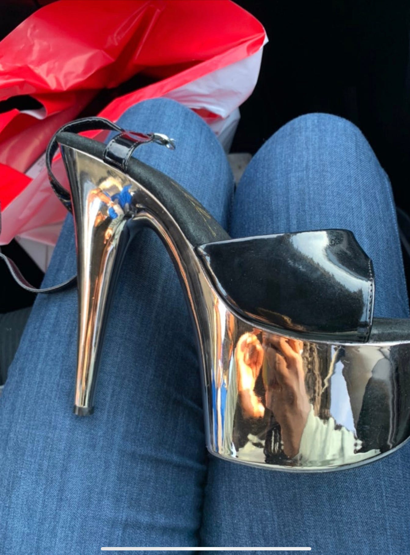 A picture of gold chrome stripper shoes with a black sole