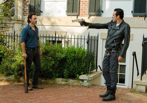 the walking dead negan pointing gun at rick