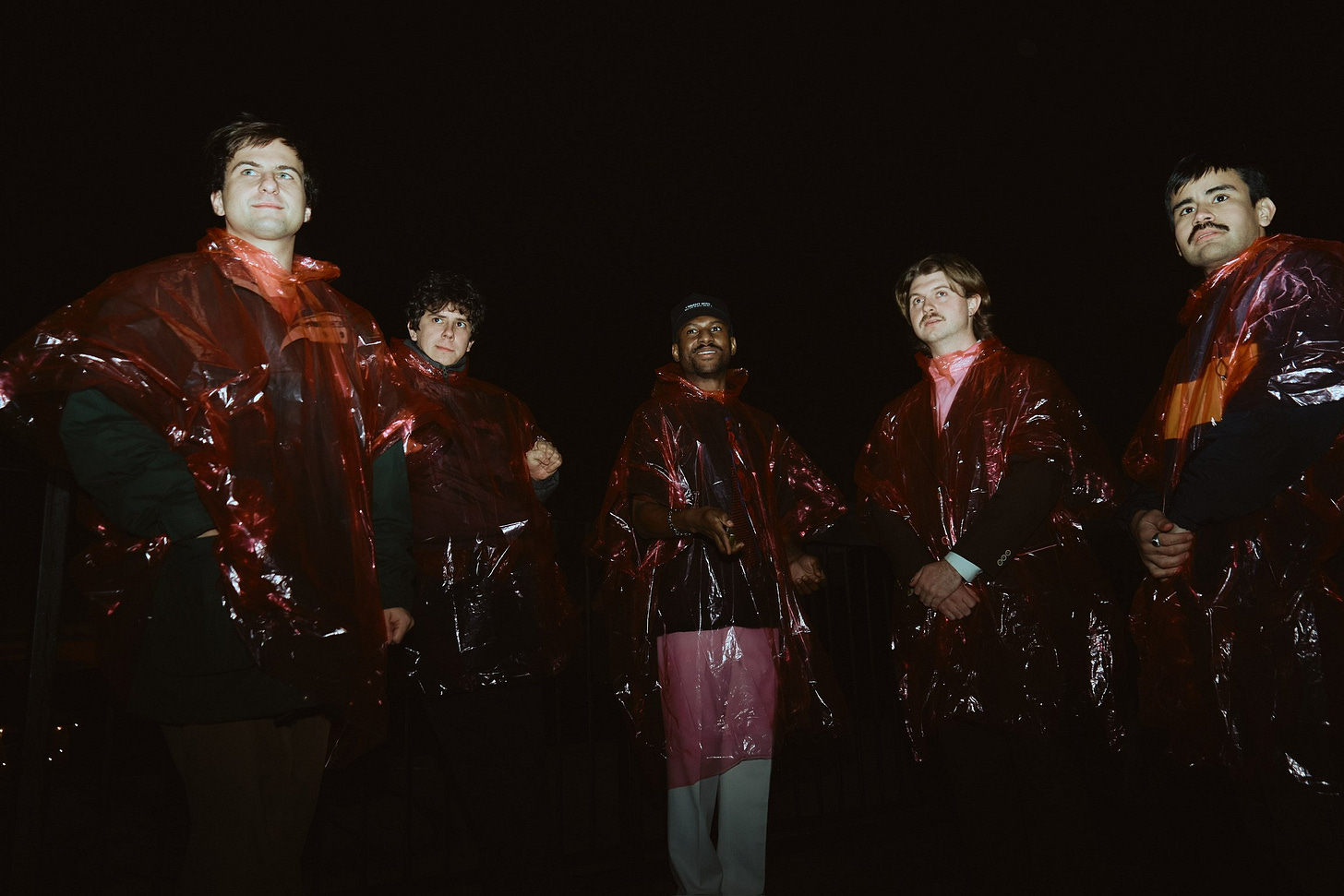 Club aqua in rain ponchos