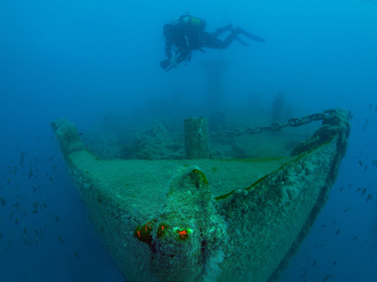 ANTALYA, TURKIYE - JUNE 16: A diver investigates the shipwreck of French Navy's Society (St. Didier) at the bottom of sea in Antalya, Turkiye on June 16, 2023. The shipwreck is filmed by underwater documentary producer and cinematographer Tahsin Ceylan and the Coast Guard Diving Safety Security and Search and Rescue (DEGAK) team. French navy ship, which is popularly called the "Society wreck" and was sunk by a British fighter jet during the Second World War. The Saint Didier is located 500 meters off the Antalya Marina and has a length of 96 meters at a depth of 30 meters. (Photo by Tahsin Ceylan/Anadolu Agency via Getty Images)