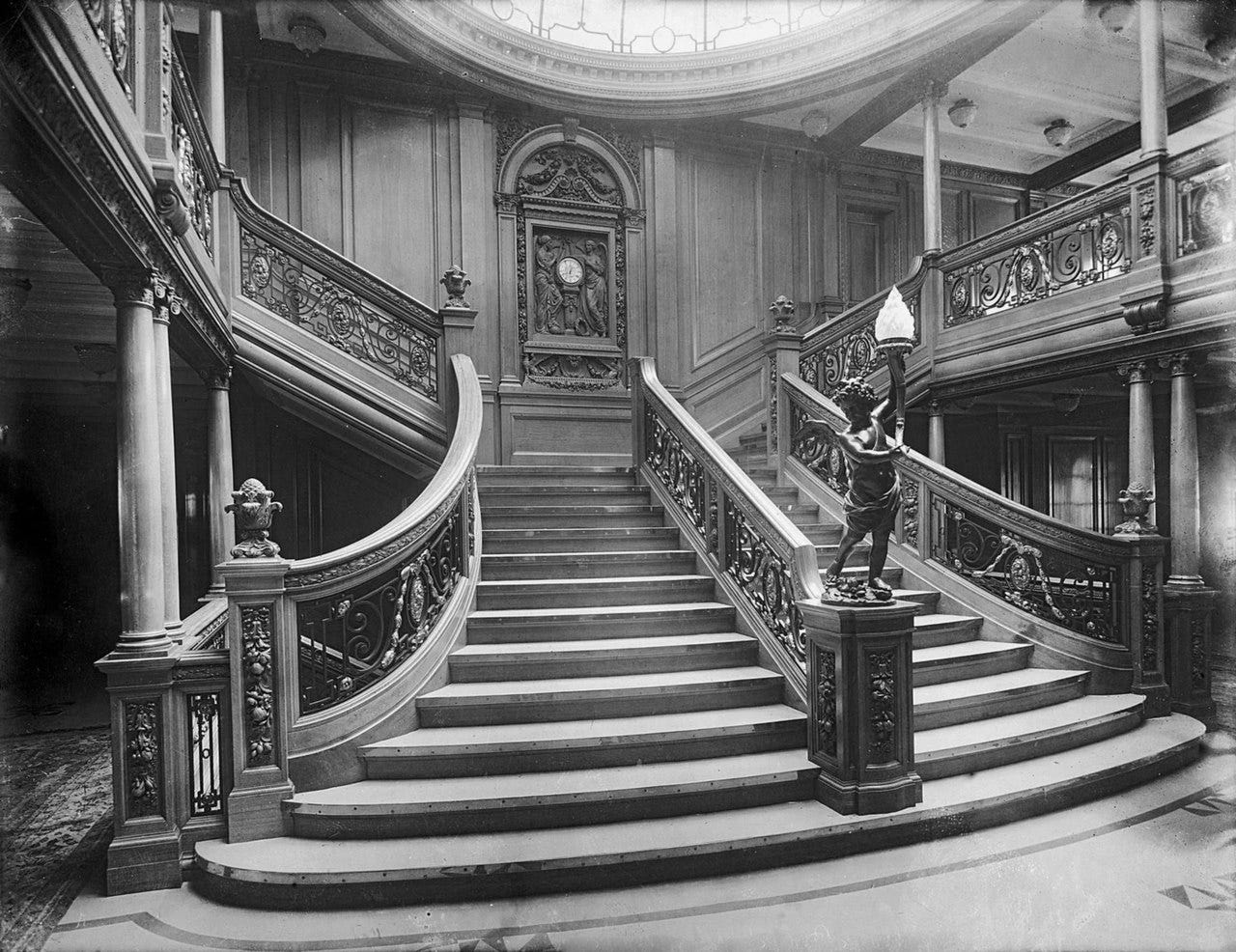 The Forward First Class Grand Staircase of Titanic's sister ship RMS Olympic. Titanic's staircase would have looked nearly identical. No known photos of Titanic's staircase exist.