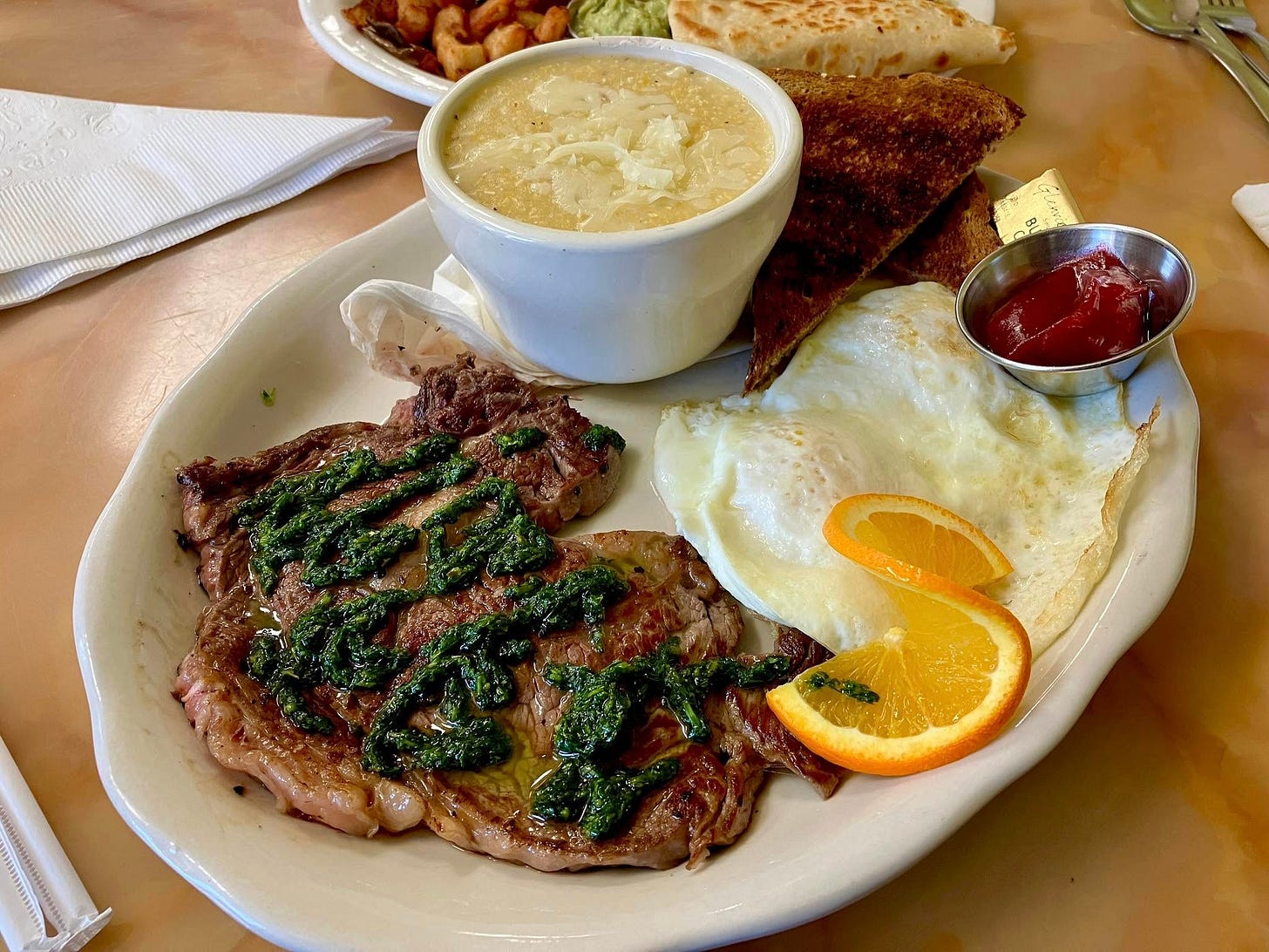 May be an image of omelet, steak and rye bread