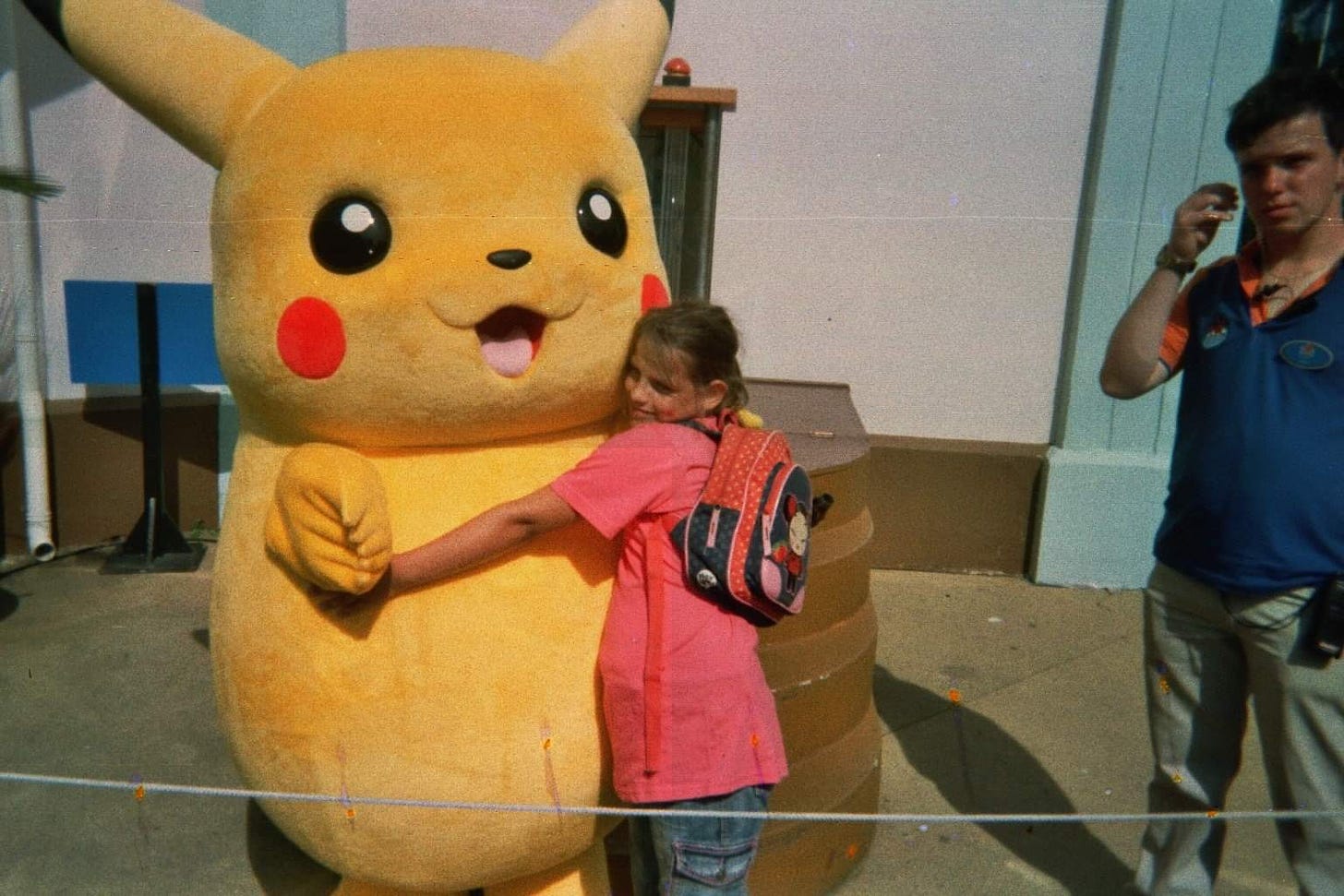 Kimberley hugging a Pikachu mascot at the Pokémon Day event in Walibi World, The Netherlands, in 2008