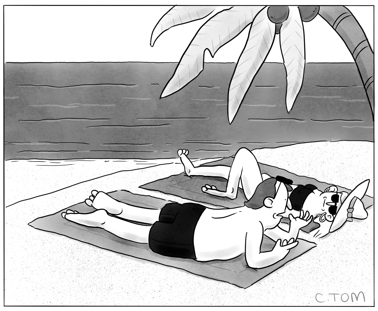 A man and woman talk laying on a beach.