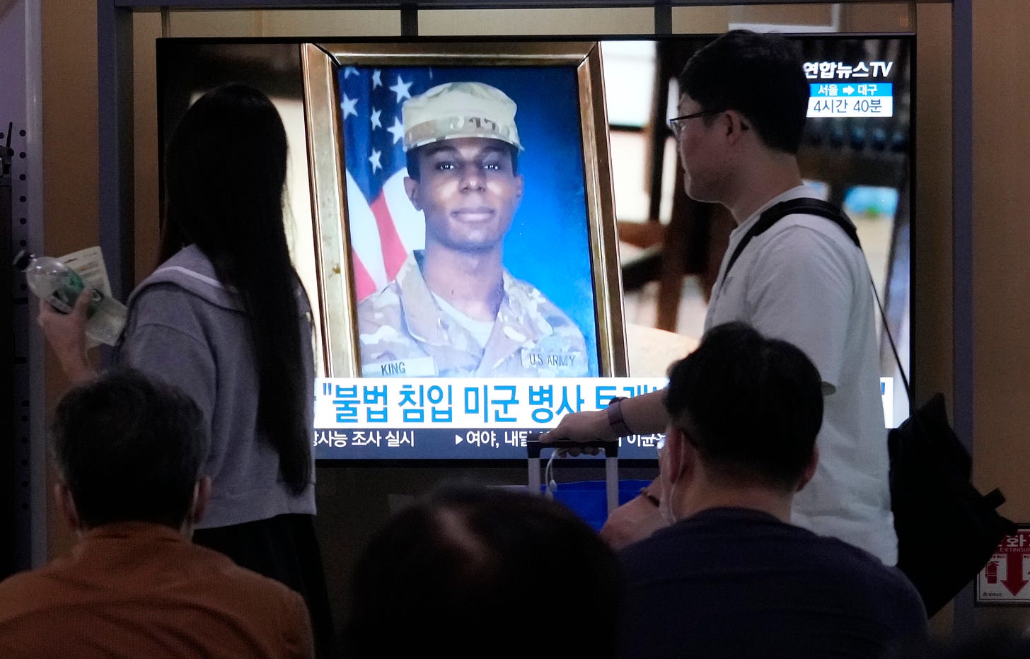 A TV screen shows a file image of American soldier Travis King during a news program at the Seoul Railway Station in Seoul, South Korea, Wednesday, Sept. 27, 2023. 