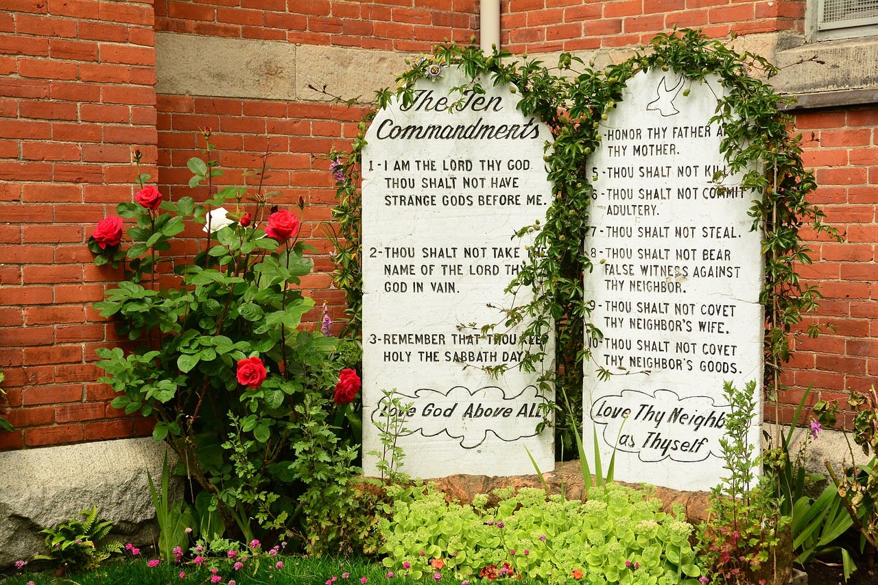 Signs showing the 10 commandments in front of a church.