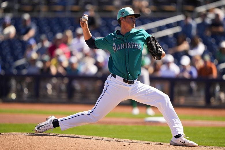 Seattle Mariners starting pitcher Emerson Hancock throws against the Oakland Athletics during the first inning of a spring training baseball game Saturday, March 2, 2024, in Peoria, Ariz.  (Lindsey Wasson / The Associated Press)
