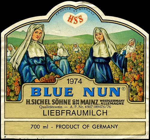 Label for Blue Nun Liebfraumilch, with image of blue-and-white habited nuns in a vineyard