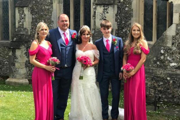 Dean and Julie on their wedding day with their children. (Image: Bradford family)