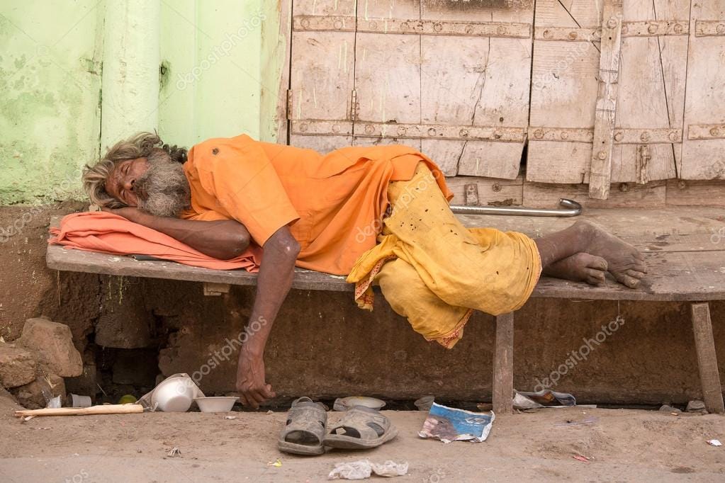 Indian homeless man sleeps near the ghat along the sacred Sarovar lake –  Stock Editorial Photo © OlegDoroshenko #71048765