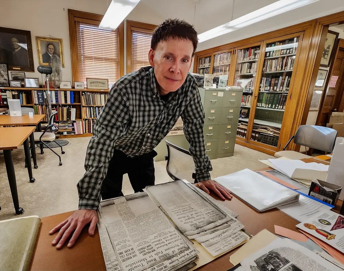  Historian Mike Disotelle goes over documents in his office in Ilion, N.Y., on Dec. 11, 2023. (Allan Stein/The Epoch Times)