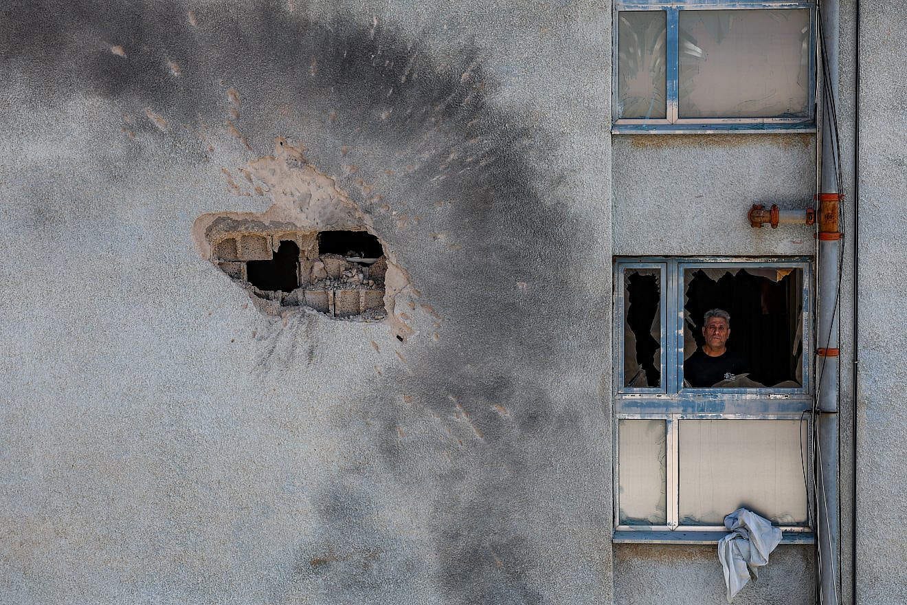 The damage after a rocket fired from Lebanon hit a building in the northern Israeli town of Kiryat Shmona, Feb. 11, 2024. Photo by David Cohen/Flash90.