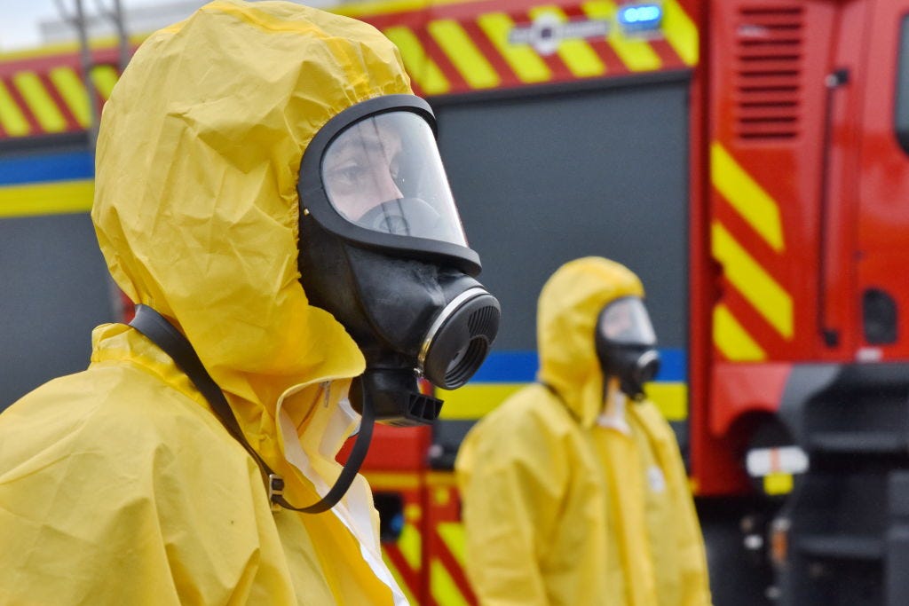 Ukrainian emergency workers seen wearing radiation