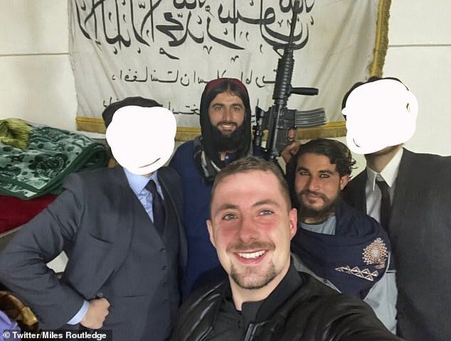 Miles Routledge, aka 'Lord Miles', has praised the Talbian's 'fair' and 'not corrupt' judicial system. He is seen smiling as he poses for a selfie with his Taliban 'captors'