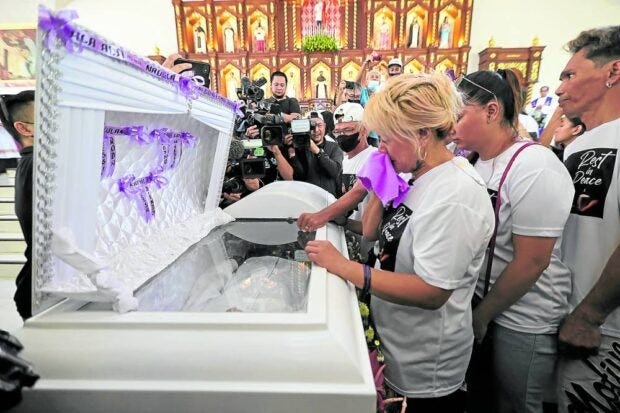 Rodaliza Baltazar, the OFW mother of slain teenager Jemboy Baltazar, bids her last farewell to her son during a funeral mass at the San Lorenzo Parish in Navotas City on Wednesday, Aug. 16, 2023.