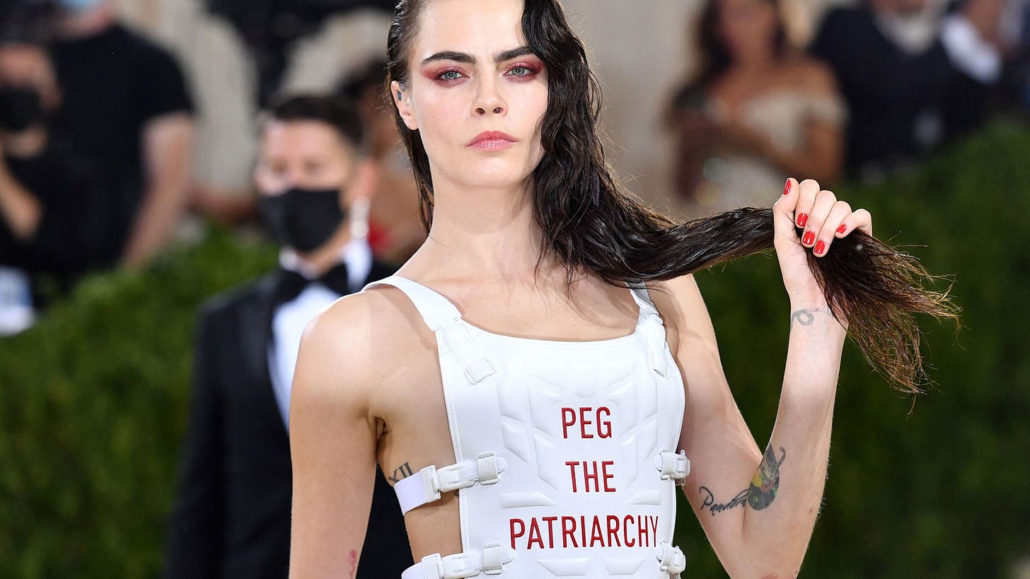 Cara Delevingne's “Peg the Patriarchy” Outfit Sparks Controversy | Them