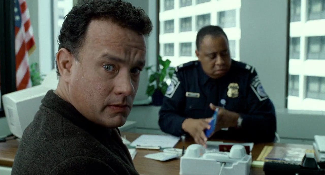 Tom Hanks looks worried in ‘The Terminal.’