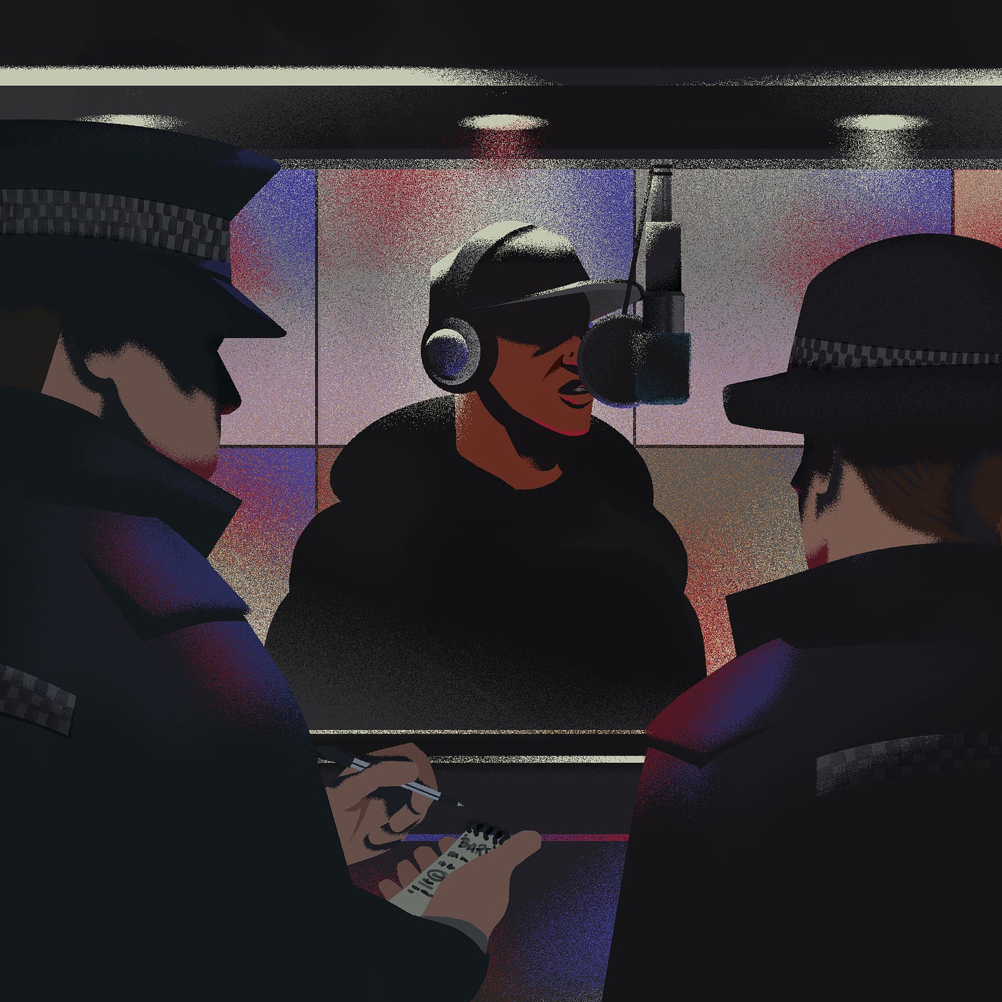 A young man wearing a black hoodie and black baseball hat, wearing headphones, records music in a studio while being watched by one male and one female police officer. The male police officer takes notes on the content of the lyrics.