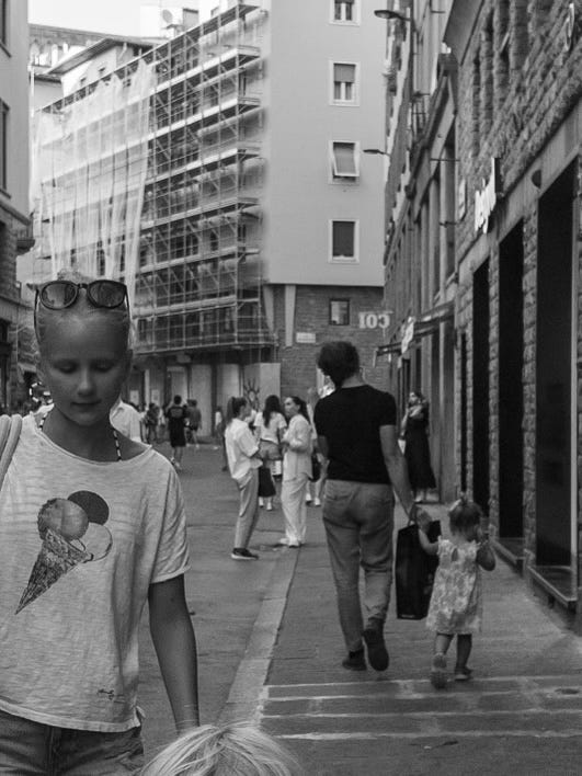 Photo of street with people; taken by Emily Shefferman