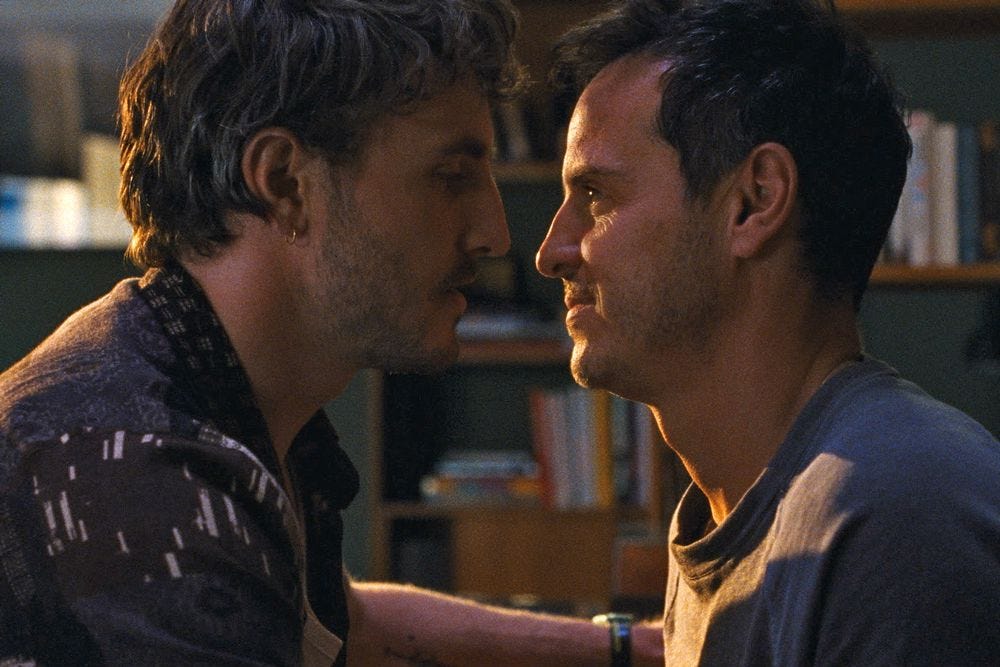 Two white men gazing at each other, about to kiss