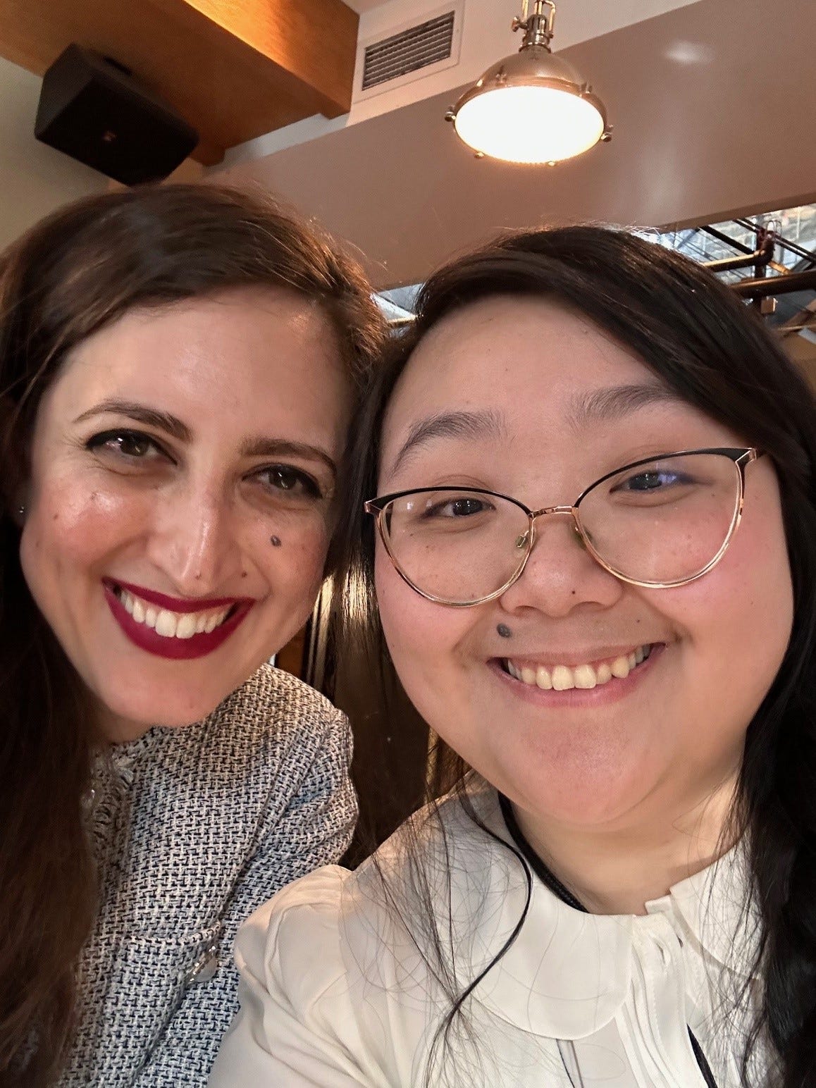 Heidi and Srishti smiling and posing for a selfie