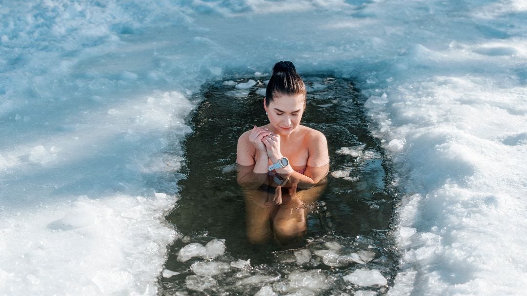 Woman in ice bath practicing discipline and resilience to build strong character.