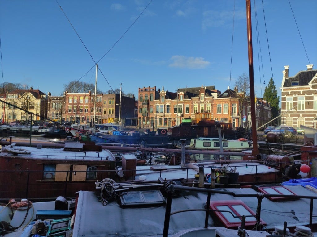 Boats crowded together on the canal around Groningen.