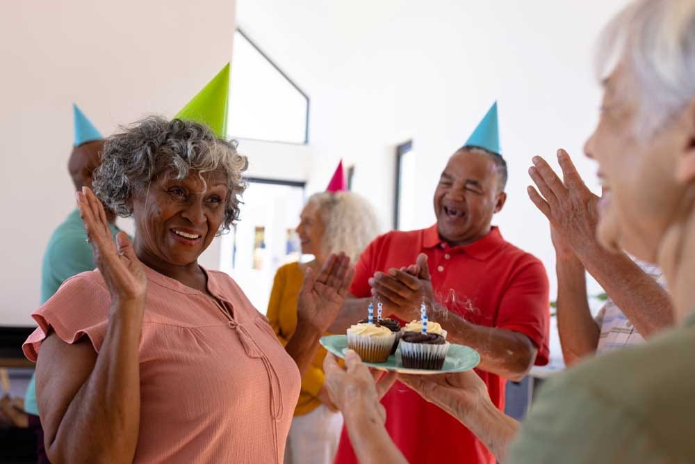 Elders partying together to celebrate their friend’s birthday.