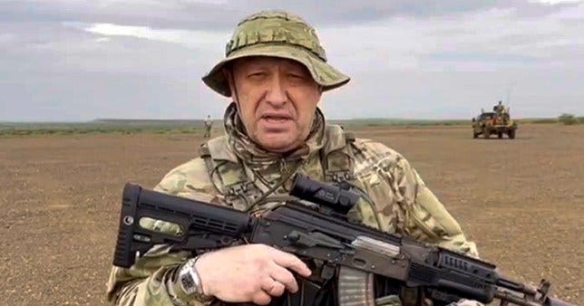 Yevgeny Prigozhin holding a gun in Africa in first video since failed Russian mutiny.