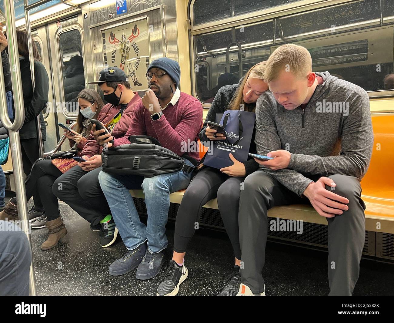Glued to phones hi-res stock photography and images - Alamy