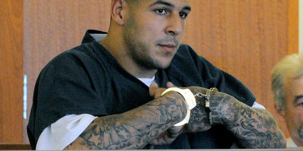 Aaron Hernandez cuffed for prison 2015