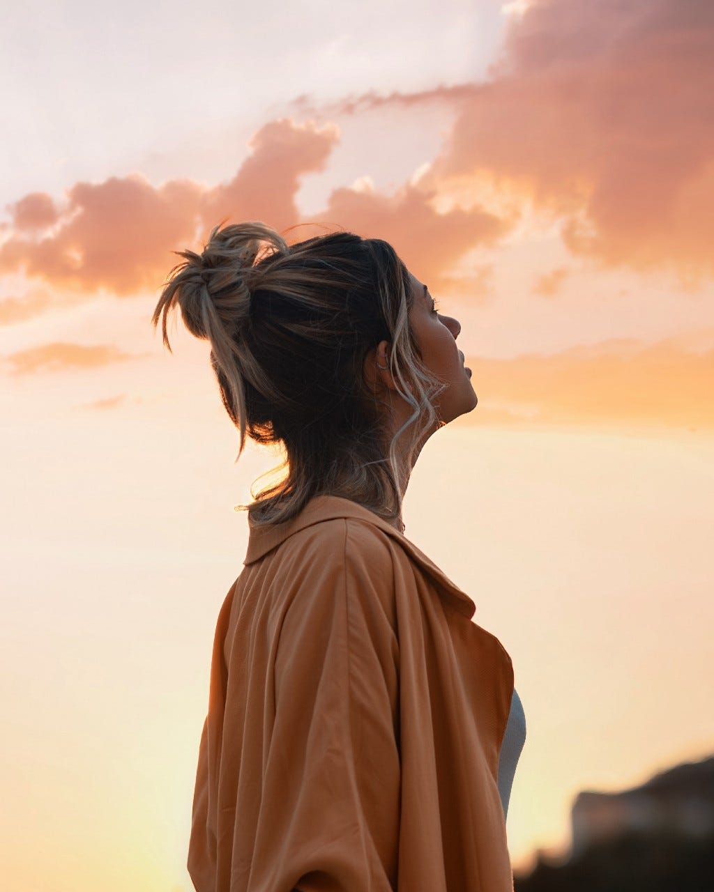 Picture of a woman looking towards the sky.