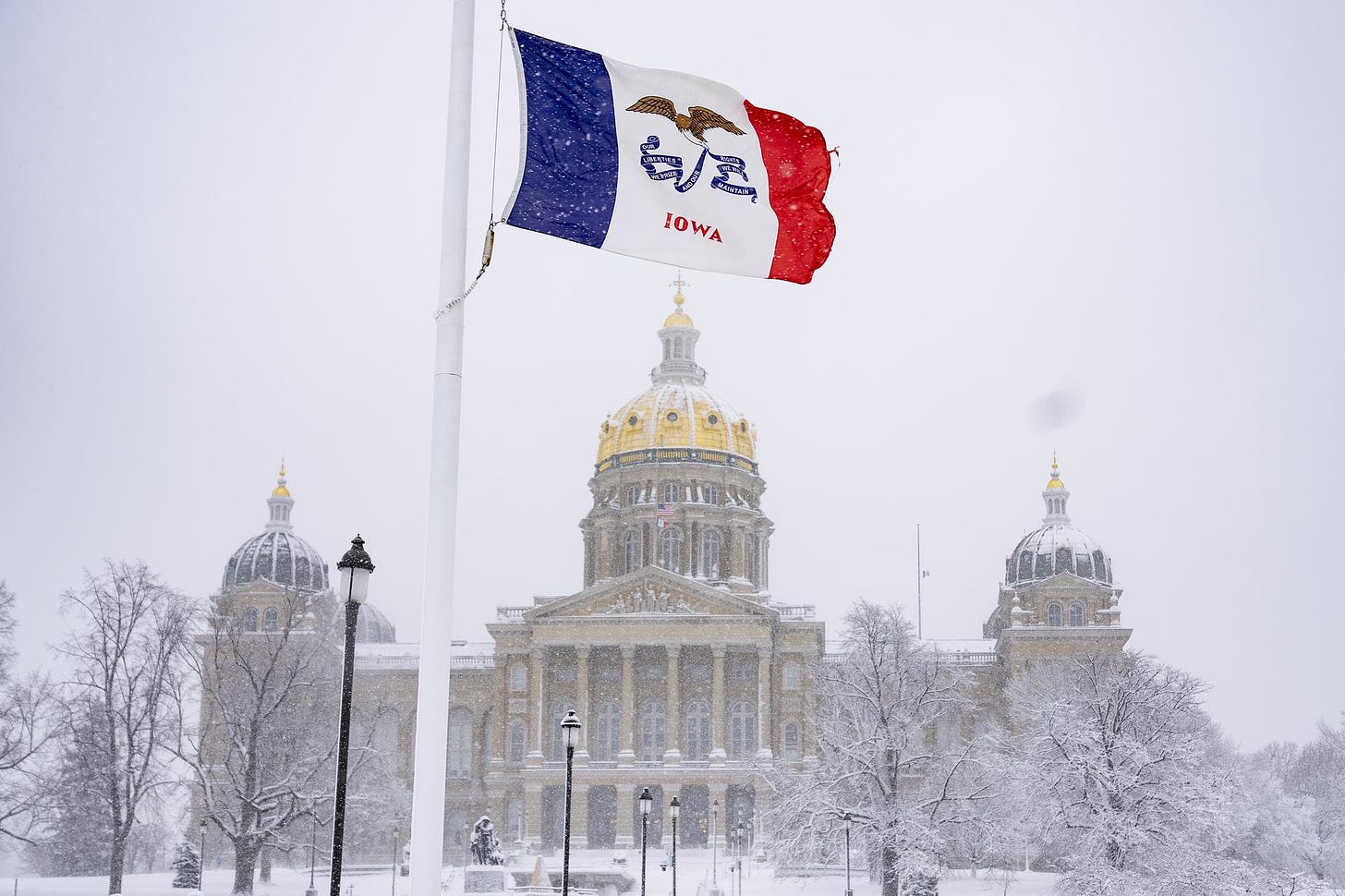 A snow-covered Iowa State Capitol building.