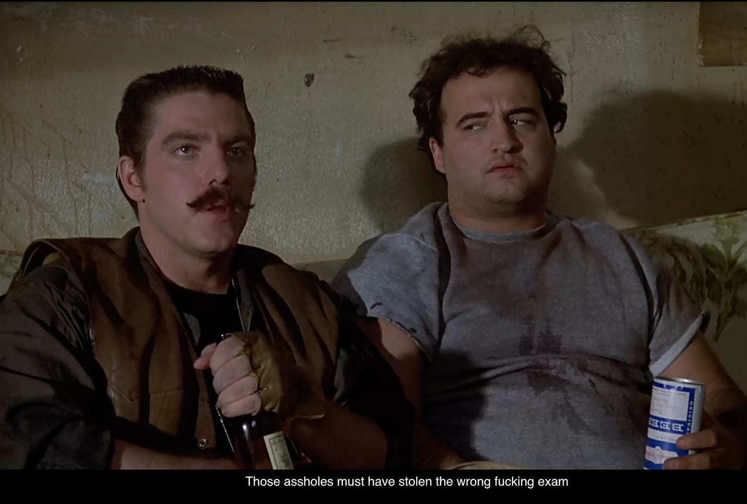 Still from Animal House with John Belushi and the line: "Those assholes must have stolen the wrong fucking exam."