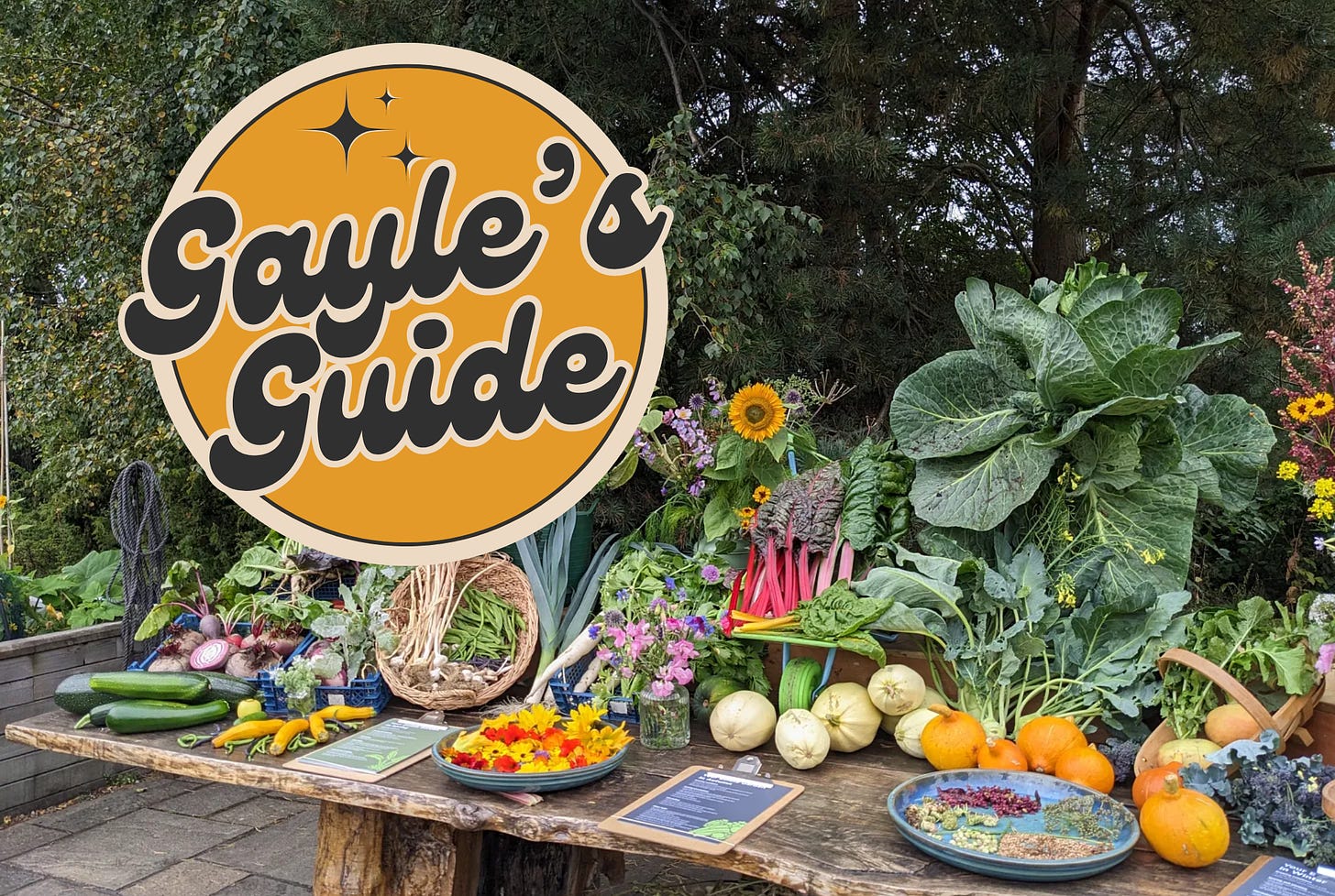 table full of vegetables and flowers from the harvest