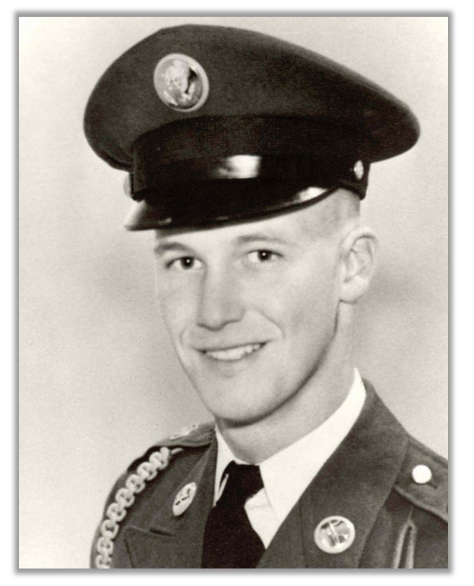 Headshot of Jimmy G Stewart, in uniform.  He is smiling and looks young. 